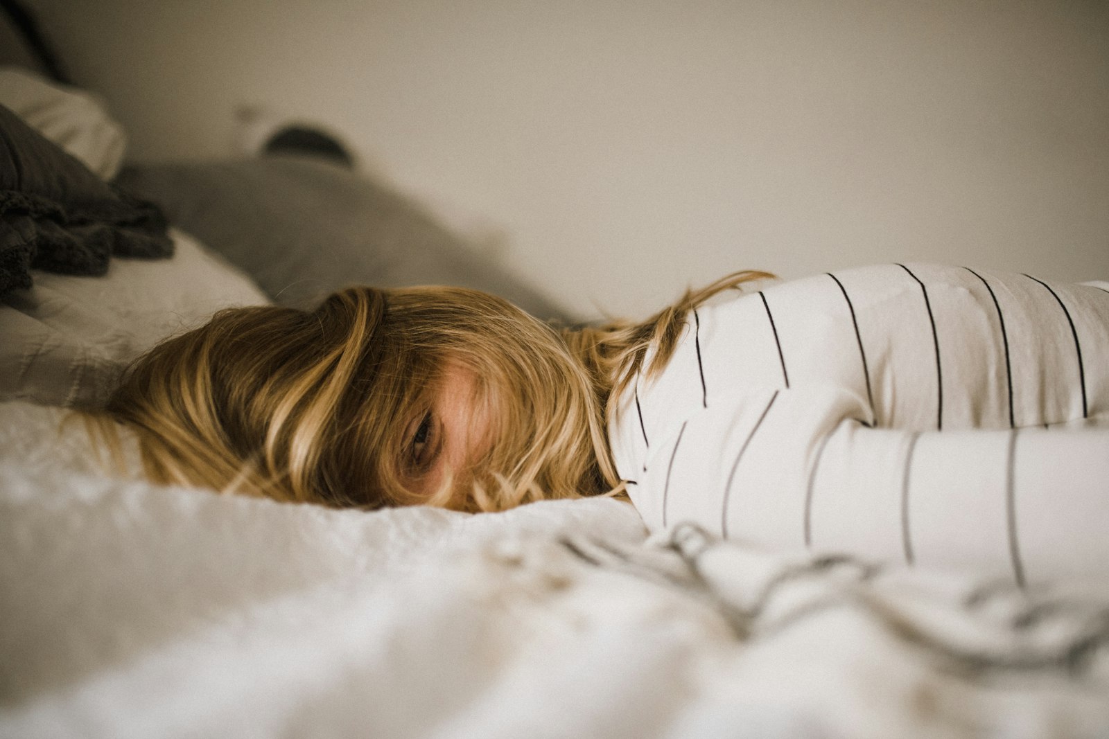 A woman asleep in soft morning light